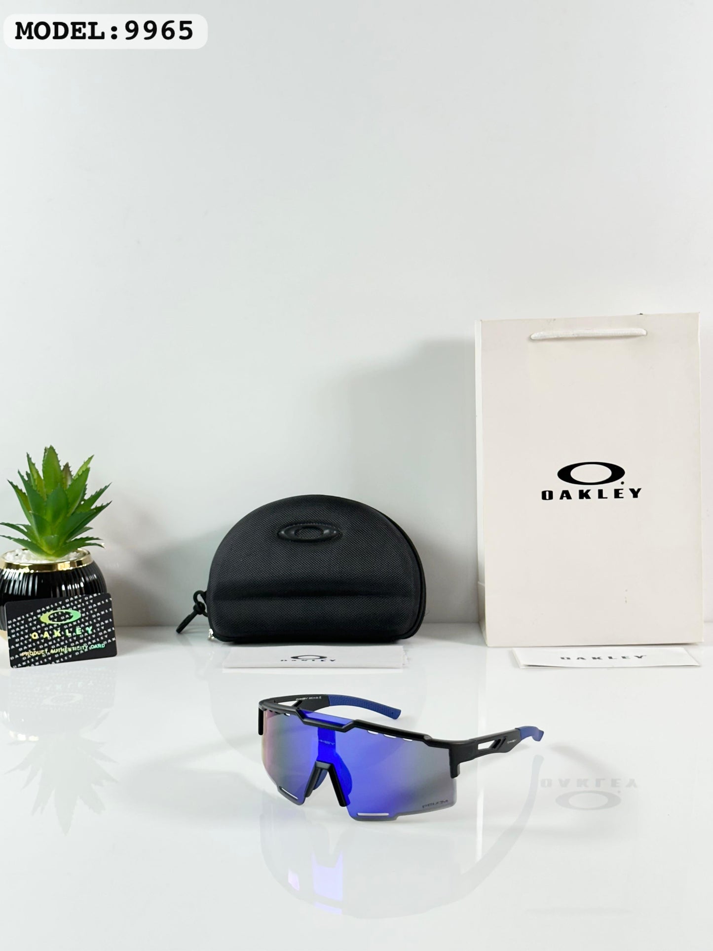 Oakley 9965 Black/Blue Reva